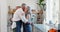 Couple, kitchen and dance with commitment, trust and support for communication, celebration and retirement. Senior