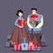 Couple in Korean traditional costume with holiday gifts