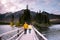 Couple by the lake watching sunset, Pyramid lake Jasper during autumn in Alberta Canada, fall colors by the lake during