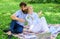 Couple with laptop relax natural environment. Family enjoy relax nature background. Couple bearded man and blonde woman