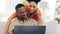 Couple, laptop and smile with hug on sofa in home living room, online browsing or web scrolling. Interracial, computer