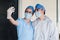 Couple of latin women doctors taking a photo selfie with a smartphone in a Mexican hospital in Mexico or Latin America