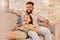 Couple, laughing and phone funny meme content of happy people laughing on a lounge home couch. Mobile video streaming