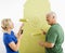 Couple laughing at smiley face painting.