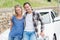 Couple leaning on the bonnet