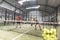 Couple learning in paddle tennis class