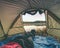 Couple legs rest in tent at lake. Hiker enjoy  view