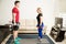 Couple lifting weights at home together