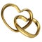 Couple of linked gold wedding rings in shape of heart