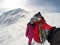 Couple looking at distance on mountain terrain