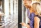 Couple looking at jewelry store window