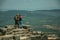 Couple looking the landscape from wall of Castle