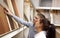 Couple looking at parquet board for home flooring in store