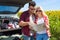 Couple looking road map standing sunflowers field outdoor