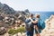 Couple looking at Sea and rocks at Capo Testa