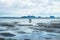 Couple looking for seafood during low tide in ocean at Koh Mook, Thailand, Asia