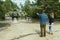 Couple looking at their family dream house in forest