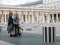 Couple lounges among the Colonnes de Buren, Palais Royal, Paris