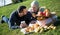 Couple lounging at picnic outdoors