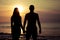 Couple in love back light silhouette on sea