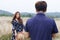 Couple love in a blue dress on a wheat field. woman in meadow concept , valentine