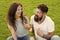 Couple in love cheerful youth booth props. Man bearded hipster and pretty woman cheerful faces. Youth day. Summer