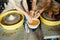 A couple in love creates a joint cup in a pottery workshop. Potter making ceramic pot on the pottery wheel