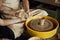 A couple in love creates a joint cup in a pottery workshop. Potter making ceramic pot on the pottery wheel