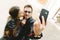 Couple in love doing a self-portrait selfie with the mobile phone