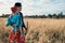 Couple in love dressed in traditional gypsy clothing posing outdoor on the autumn field