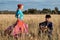 Couple in love dressed in traditional gypsy clothing posing outdoor on the autumn field