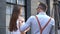 Couple in love drinking coffee and have fun on the city. young man and woman businesspeople outside