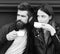 Couple in love drinks espresso during coffee break. Hot beverage and dating. Girl and bearded guy have coffee