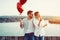 Couple in love holding red baloons hearts on valentine day