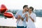 Couple in love holding red baloons hearts on valentine day