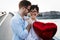 Couple in love holding red baloons hearts on valentine day