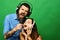 Couple in love holds microphone, sings on green background