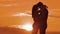 Couple in love hugging at sunset sunlight silhouette. family love concept love. Couple man and girl silhouettes of love