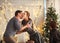 Couple in love husband and wife in hug together at home in Christmas