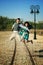 couple in love jumping in air high in middle of the street in old vintage town