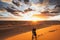 Couple in love kissing Sahara desert dunes, Morocco. Freedom and escape concept