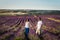 Couple in love on lavender fields. Boy and girl in the flower fields