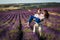 Couple in love on lavender fields. Boy and girl in the flower fields