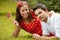 Couple in love lying on the grass in the park