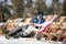 Couple in love at mountains in winter laughing and relax in sunbed