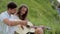 Couple In Love On Nature, Man Teaching Woman Playing In Guitar