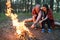 Couple love nature picnic bonfire forest concept.