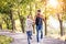 Couple in love in park on a walk, running