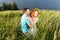 Couple in love passionately hug. Long-awaited meeting of the two lovers outside near of lake. Red hair woman and man hug