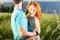 Couple in love passionately hugging. Long-awaited meeting of the two lovers outside near of lake. Red hair woman and man